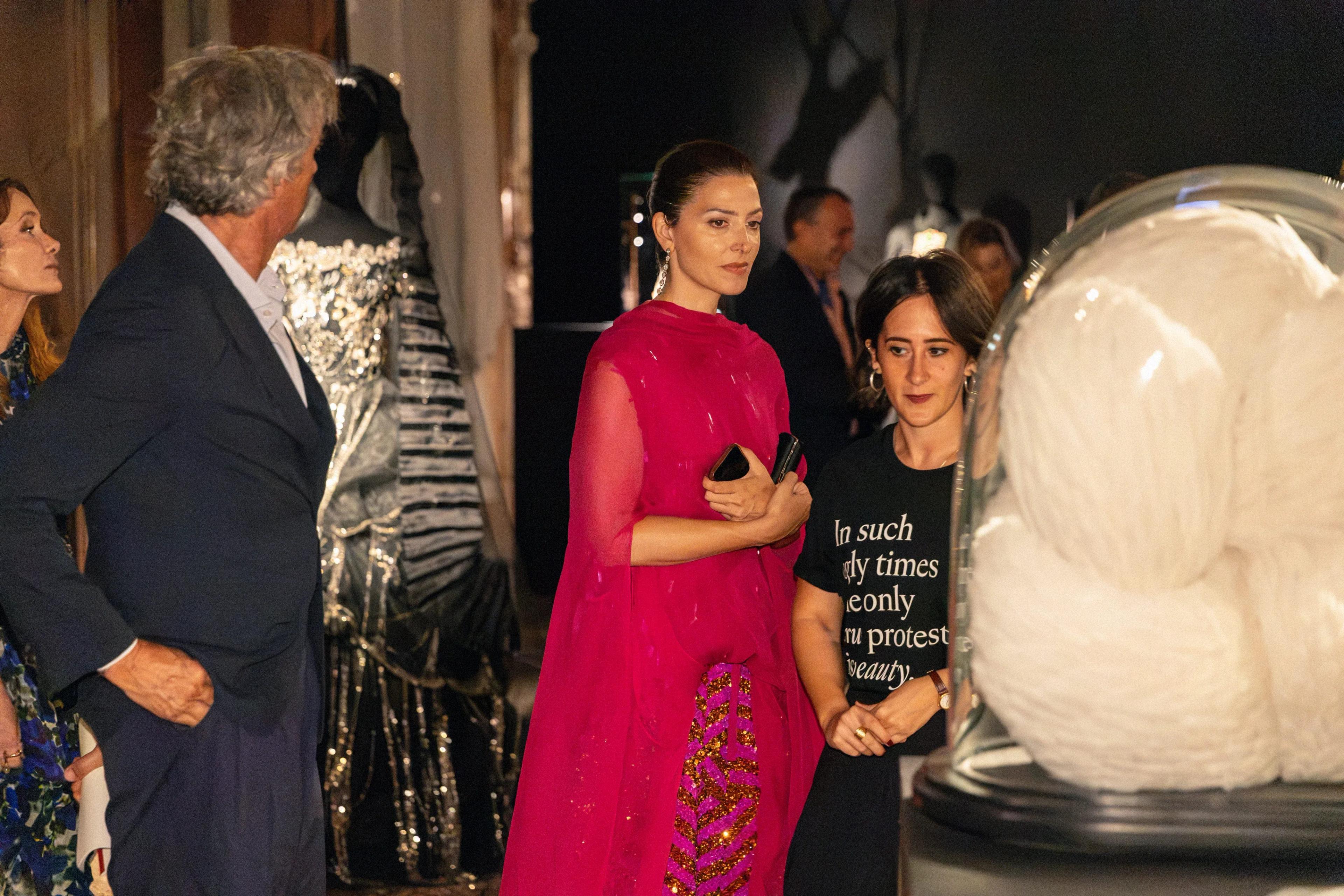 Actress Barbara Lennie arriving at the event beside a sculptural white installation