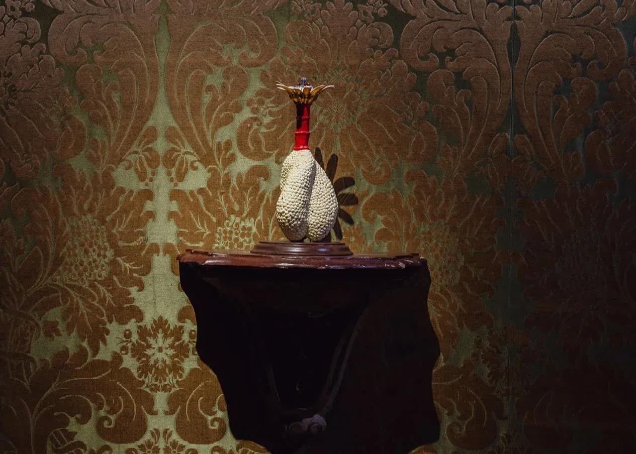 Sculptural decorative object displayed on a table at the exhibition